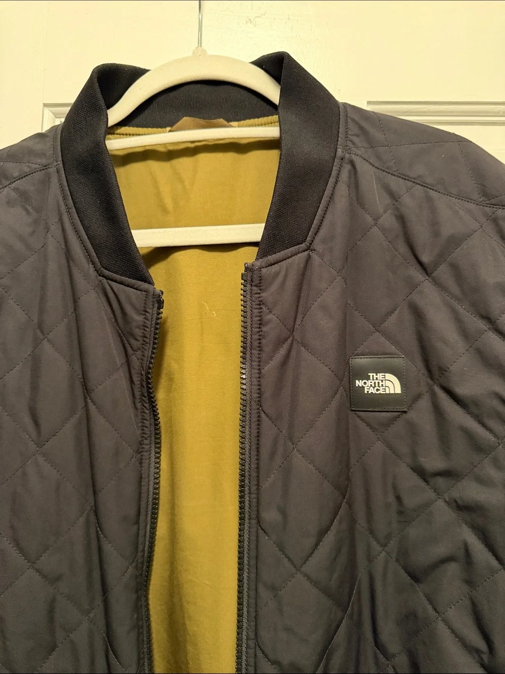 The North Face Men's reversible Black Bomber Jacket with Olive Interior M